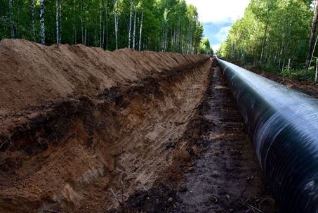 Crude oil and Natural gas pipeline construction work in forest area.